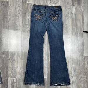 H2J Production y2k Mid Rise Bootcut Jeans with Embossed Back Pockets